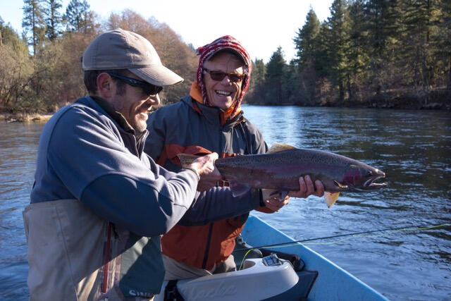 The good old days of clear skies and fresh air is something to look forward to. Guide Jim Andras, left, and Steve Kyle with a nice steelhead on the Rogue River a couple of years ago.  (Bill Lynch)