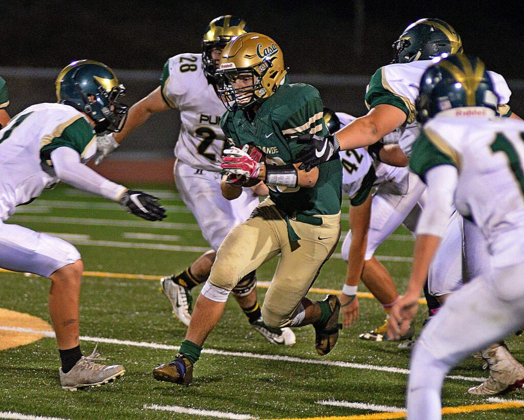 Casa Grande's Sawyer Johnson is surrounded by Maria Carrillo tacklers in a game won by Casa, 36-33, in overtime on Oct. 14.(SUMNER FOWLER/FOR THE ARGUS-COURIER)