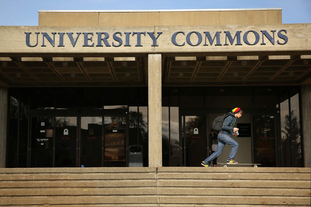 Tristan Preszler, 16, skates past the University Commons building at Sonoma State University in Rohnert Park in 2014. The University Commons will be replaced by the Wine Business Institute. (PD FILE, 2014)