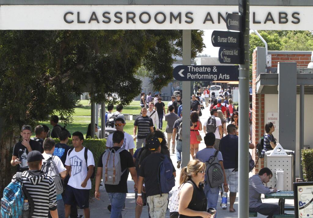 Students walk between classes at Orange Coast Community College in Costa Mesa. (DON BARTLETTI i /Los Angeles Times, 2012)