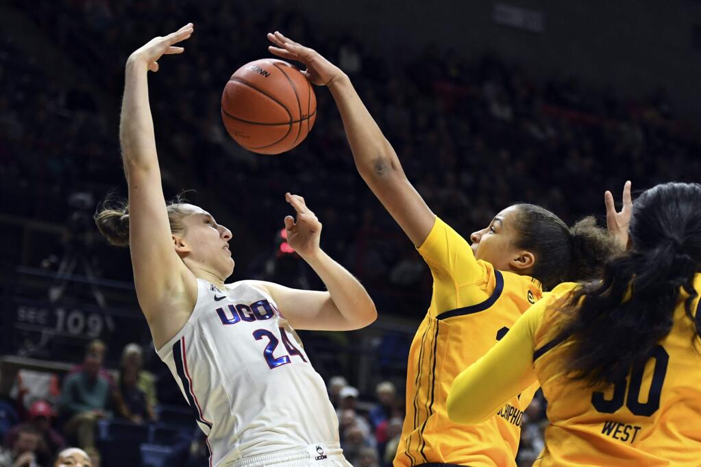 Connecticut's Anna Makurat (24) is fouled by California's Evelien Lutje Schipholt (24) in the first half of a women's NCAA college basketball game, Sunday, Nov. 10, 2019, in Storrs, Conn. (AP Photo/Stephen Dunn)