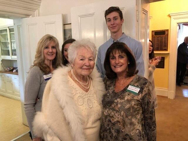 Jessie Barbour, in white, with family and friends at the celebration of her 100th birthday this week.