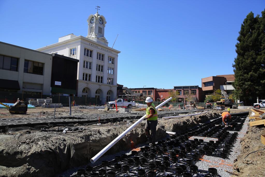 Construction workers install Silva Cells around Courthouse Square in Santa Rosa, on Wednesday, Aug. 31, 2016. The cells use soil volumes to support large tree growth and provide stormwater management. (Christopher Chung / The Press Democrat)