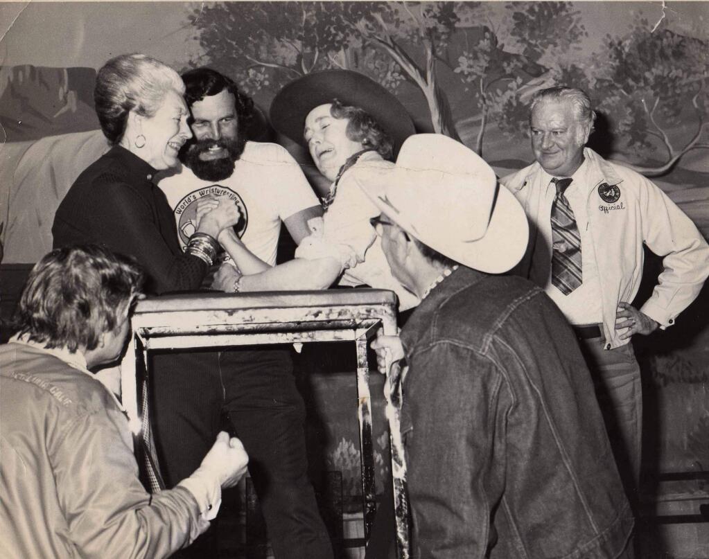 Petaluma Mayor Helen Putnam wrestling and unidentified woman in a cowboy hat at a 1970s wristwrestling tournament. (Courtesy of the Petaluma Museum)