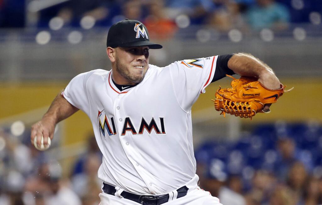 FILE - In this Friday, Sept. 9, 2016, file photo, Miami Marlins' Jose Fernandez pitches during the first inning of a baseball game against the Los Angeles Dodgers, in Miami. The Marlins announced Sunday, Sept. 25, 2016, that ace right-hander Fernandez has died. The U.S. Coast Guard says Fernandez was one of three people killed in a boat crash off Miami Beach early Sunday. (AP Photo/Wilfredo Lee, File)