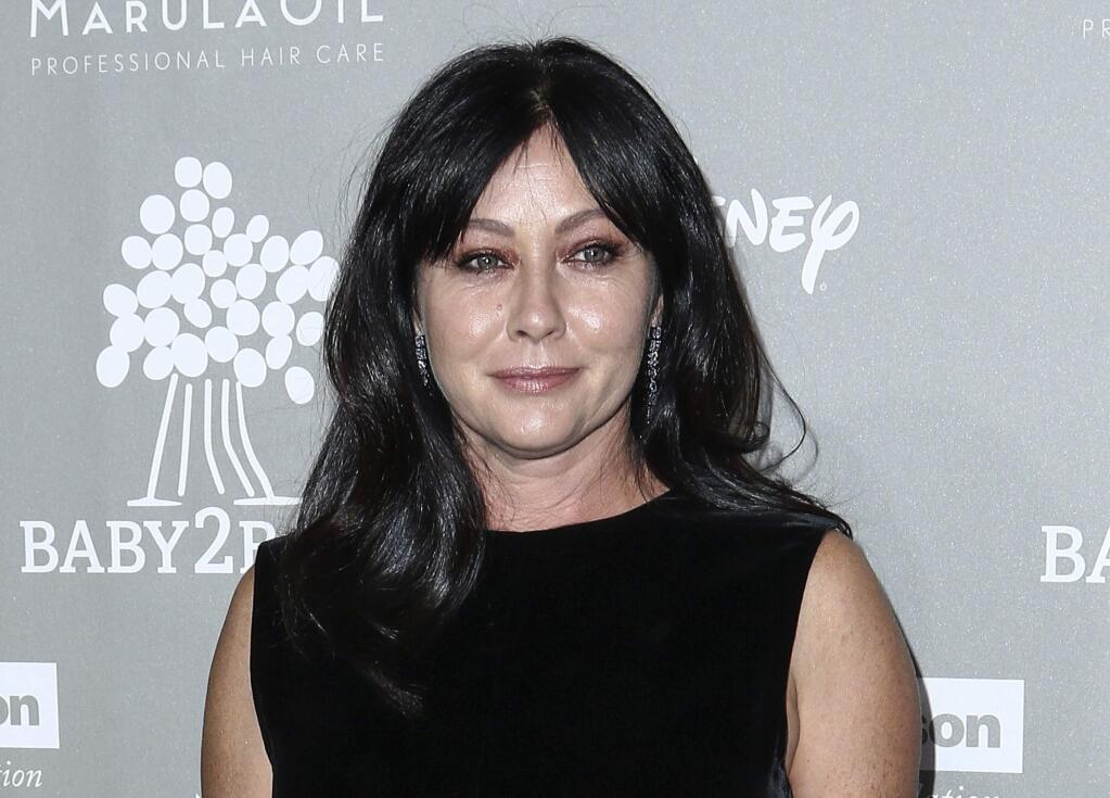 FILE - In this Nov. 14, 2015 file photo, Shannen Doherty attends the 4th Annual Baby2Baby Gala in Culver City, Calif. The 1988 movie 'Heathers,' which starred Doherty, will be adapted for TV. Doherty, who played Heather Duke in the movie, will guest star in the first episode. (Photo by John Salangsang/Invision/AP, File)