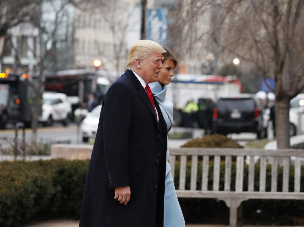 President-elect Donald Trump and his wife Melania arrives for a church service at St. John's Episcopal Church across from the White House in Washington, Friday, Jan. 20, 2017, on Donald Trump's inauguration day. (AP Photo/Alex Brandon)