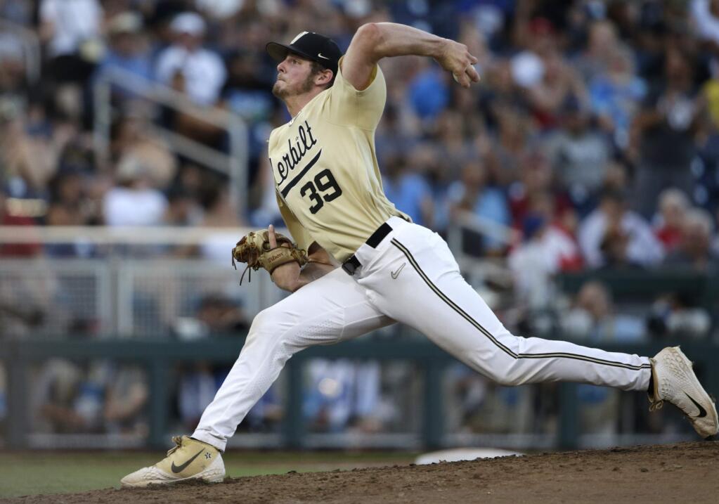 Vanderbilt's Jake Eder prepares to throw against Michigan during the seventh inning in Game 3 of the NCAA College World Series in Omaha, Neb., Wednesday, June 26, 2019. (AP Photo/Nati Harnik)