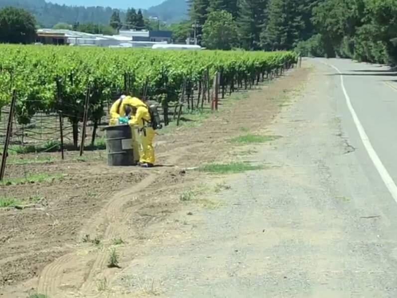A screenshot from video posted to Facebook by the City of Healdsburg Fire Department on Tuesday, June 4, 2019, showing the investigation into a 55-gallon drum left on the side on a Healdsburg road. (CITY OF HEALDSBURG FIRE DEPARTMENT/ FACEBOOK)