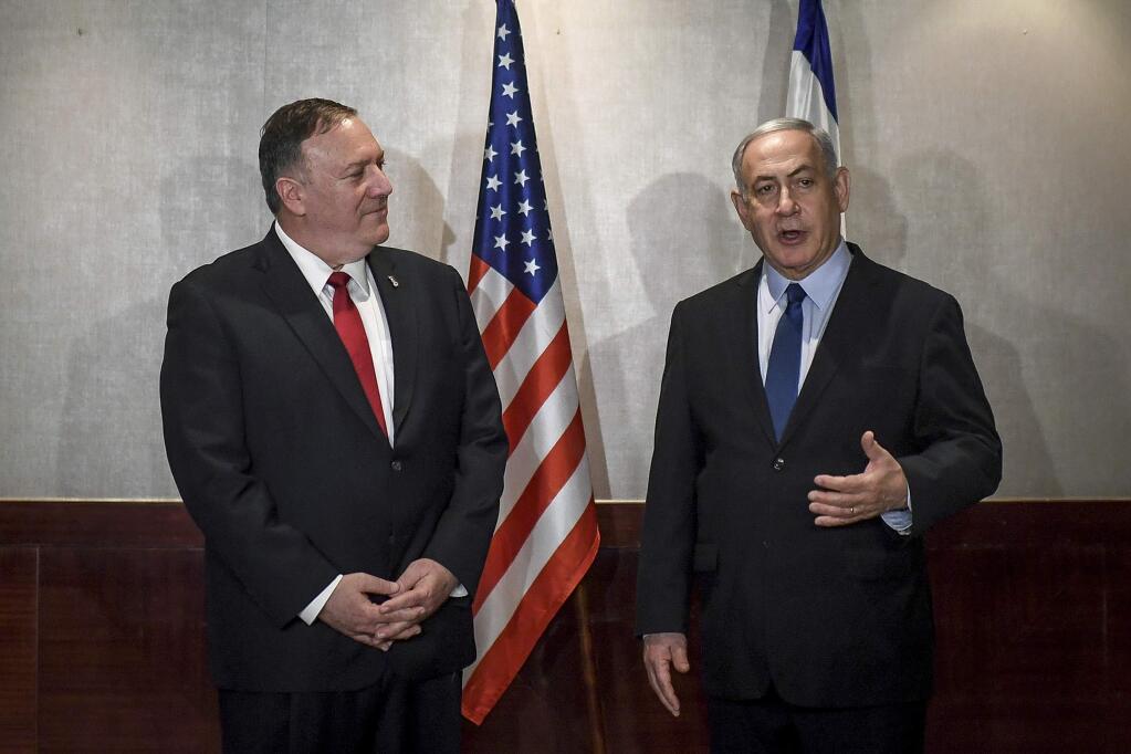 US Secretary of State Mike Pompeo and Israeli Prime Minister Benjamin Netanyahu speak during their meeting in Lisbon Wednesday, Dec. 4, 2019. (AP Photo/Patricia De Melo Moreira, Pool)