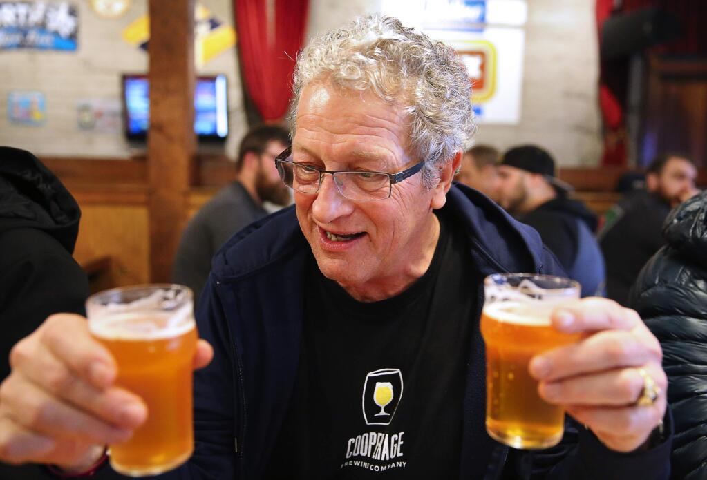Lindsay Waddell compares the taste of Pliny the Younger, left, with Pliny the Elder at the Russian River Brewing Company, in Santa Rosa, on Friday, February 3, 2017. (Christopher Chung/ The Press Democrat)