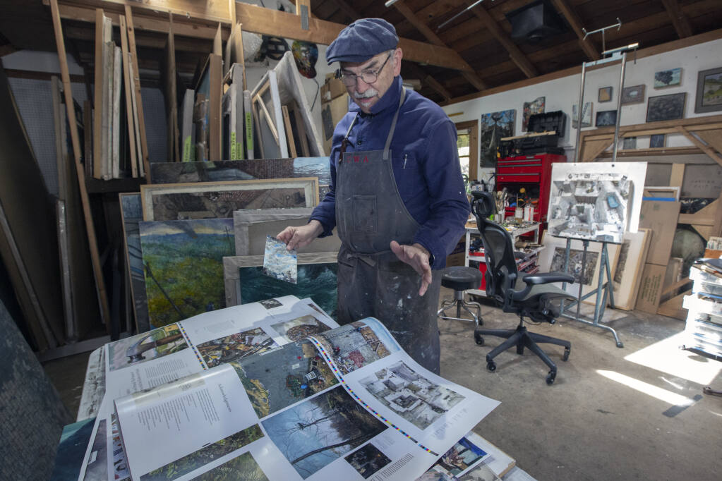 Chester Arnold, In his Sonoma studio on Thursday, April 28, 2022, looks over the proofs for an upcoming catalog that will contain many precisely colored prints of his works throughout the years. (Robbi Pengelly/Index-Tribune)