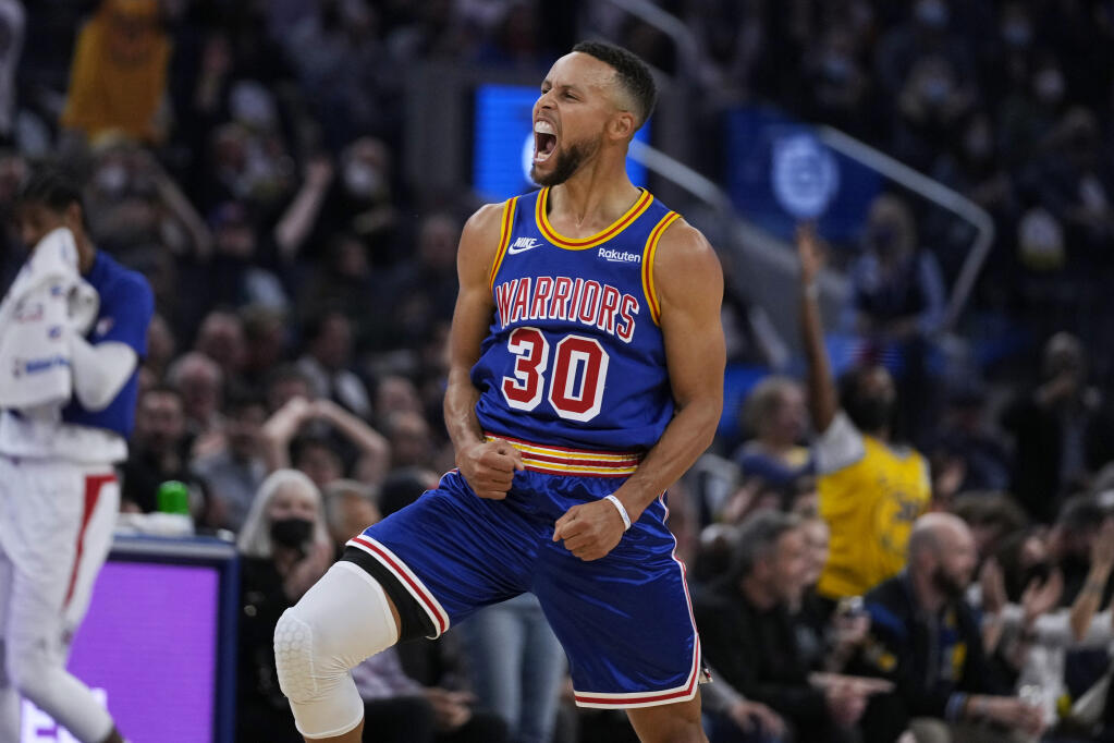 Golden State Warriors guard Stephen Curry reacts after making a 3-point shot against the Los Angeles Clippers during the first half in San Francisco on Thursday, Oct. 21, 2021. (Tony Avelar / ASSOCIATED PRESS)
