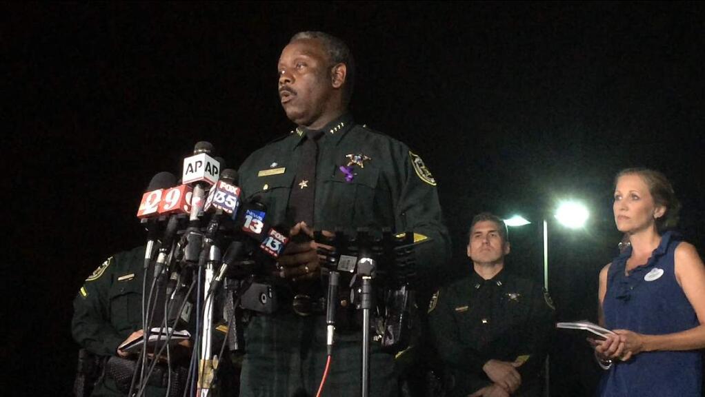 Orange County Sheriff Jerry Demings speaks at a news conference about a 2-year-old boy who was dragged into the water by an alligator on the shores of Disney's Grand Floridian Resort & Spa Tuesday night, June 14, 2016, in Orlando, Fla. The family of five from Nebraska was on vacation and wading in a lake Tuesday evening when the attack happened, Demings told a news conference. The father tried to rescue his son but was unsuccessful, Demings said. (Christal Hayes/Orlando Sentinel via AP)