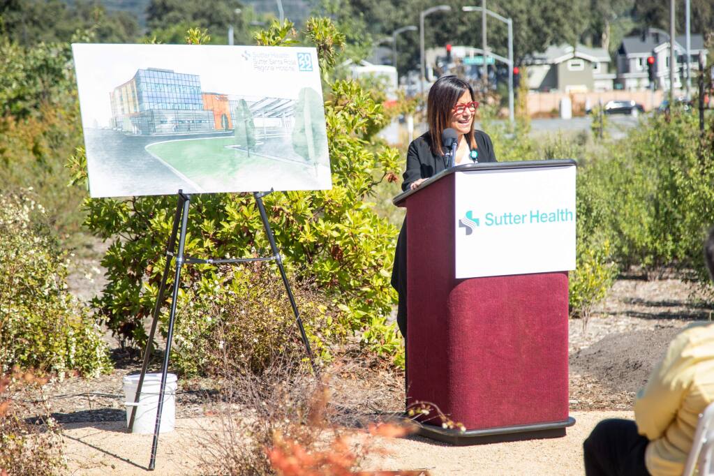 Julie Petrini, CEO of Sutter Bay Area Hospitals, speaks at the Friday, Sept. 20, 2019, groundbreaking ceremony for a 40-room expansion project, seen in the architectural rendering at left, for Sutter Santa Rosa Regional Hospital. (Landis Communications photo)