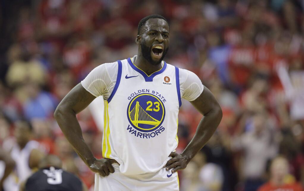 Golden State Warriors forward Draymond Green reacts after he was called for a foul against Houston Rockets guard James Harden during the first half of Game 1 of the NBA Western Conference final, Monday, May 14, 2018, in Houston. (AP Photo/David J. Phillip)