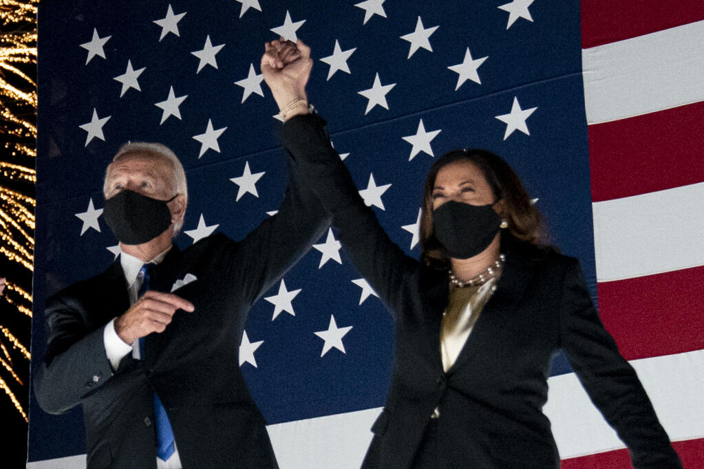 Democratic presidential candidate former Vice President Joe Biden and his running mate Sen. Kamala Harris, D-Calif., watch fireworks during the fourth day of the Democratic National Convention, Thursday, Aug. 20, 2020, at the Chase Center in Wilmington, Del. (AP Photo/Andrew Harnik)