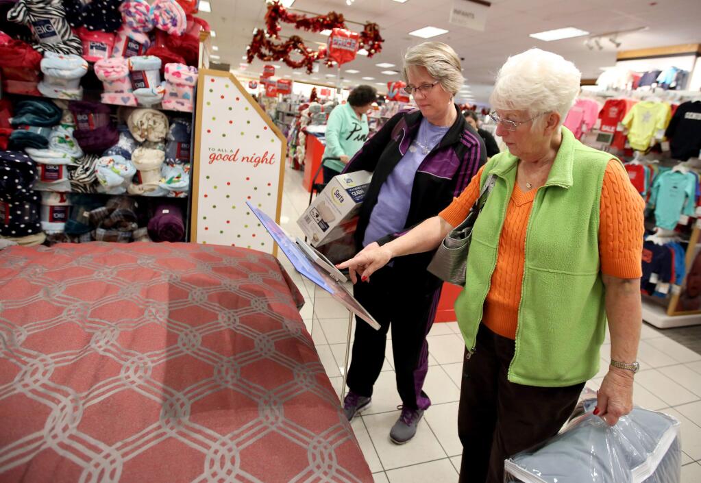 Nancy Wikeen, left, of Pittsburg, Ca. and her mom Marian Rodgers, right, of Windsor, shop for an air mattress and a comforter at Kohl's in Santa Rosa, Thursday, November 27, 2014. (Crista Jeremiason / The Press Democrat)