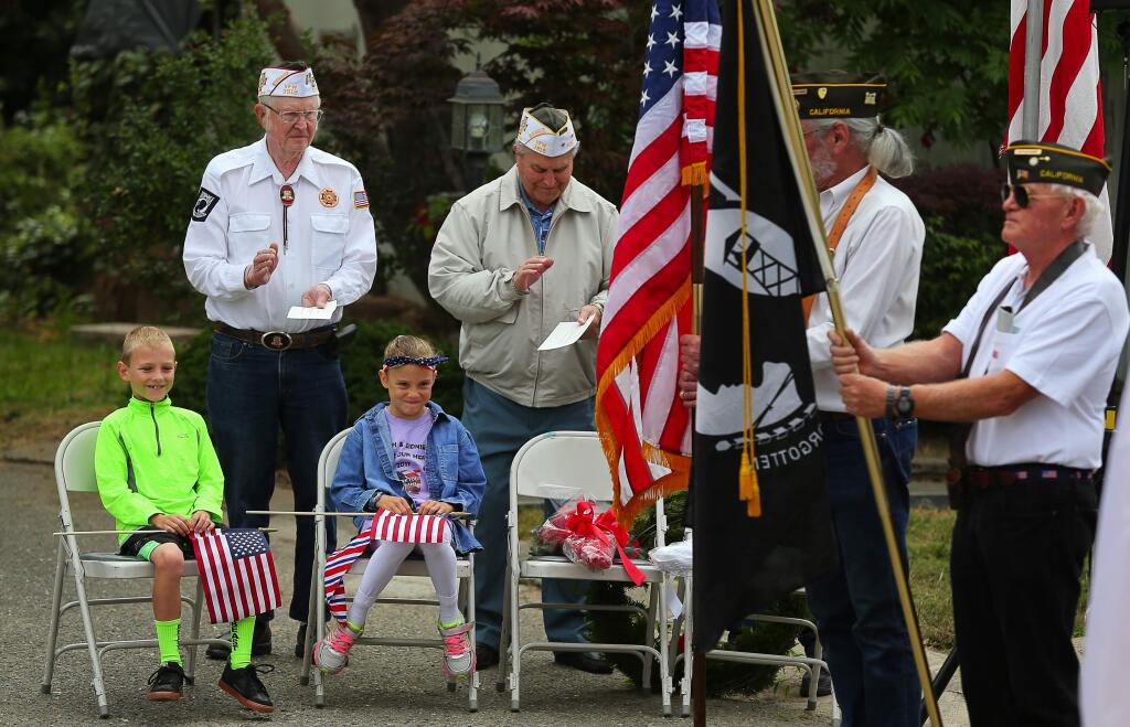 Nine-year-old twins Cash, left, and Sidnie Cornish are acknowledged for their fundraising effort during in Sebastopol's Memorial Day ceremony at Sebastopol Memorial Lawn Cemetery, Monday, May 29, 2017. The twins were able to raise $2,950 for Veterans of Foreign Wars.(Christopher Chung/ The Press Democrat)