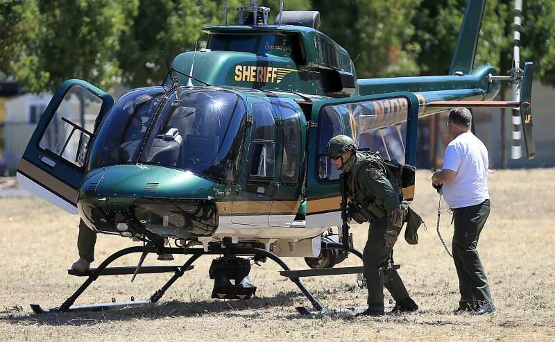 (File photo) Henry 1, the Sonoma County Sheriff's helicopter, was used to search for suspects in Calistoga in July 2016. (Kent Porter/The Press Democrat)
