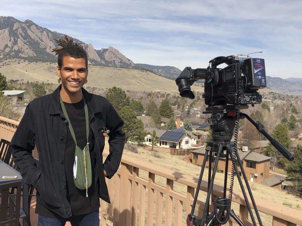 In this undated photo provided by lawyer Siddhartha Rathod, Zayd Atkinson poses for a photo. Atkinson was picking up trash outside his dormitory when a white police officer in Boulder, Colo., detained him in March, 2019. The officer, John Smyly, resigned this week under an agreement with city officials who found he had violated department policies. (Siddhartha Rathod via AP)