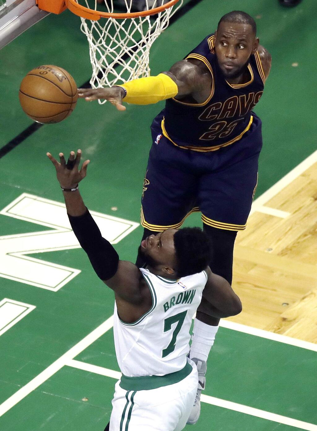 Cleveland Cavaliers forward LeBron James, top, blocks a shot by Boston Celtics forward Jaylen Brown during the first half of Game 5 of the NBA basketball Eastern Conference finals, on Thursday, May 25, 2017, in Boston. (AP Photo/Charles Krupa)