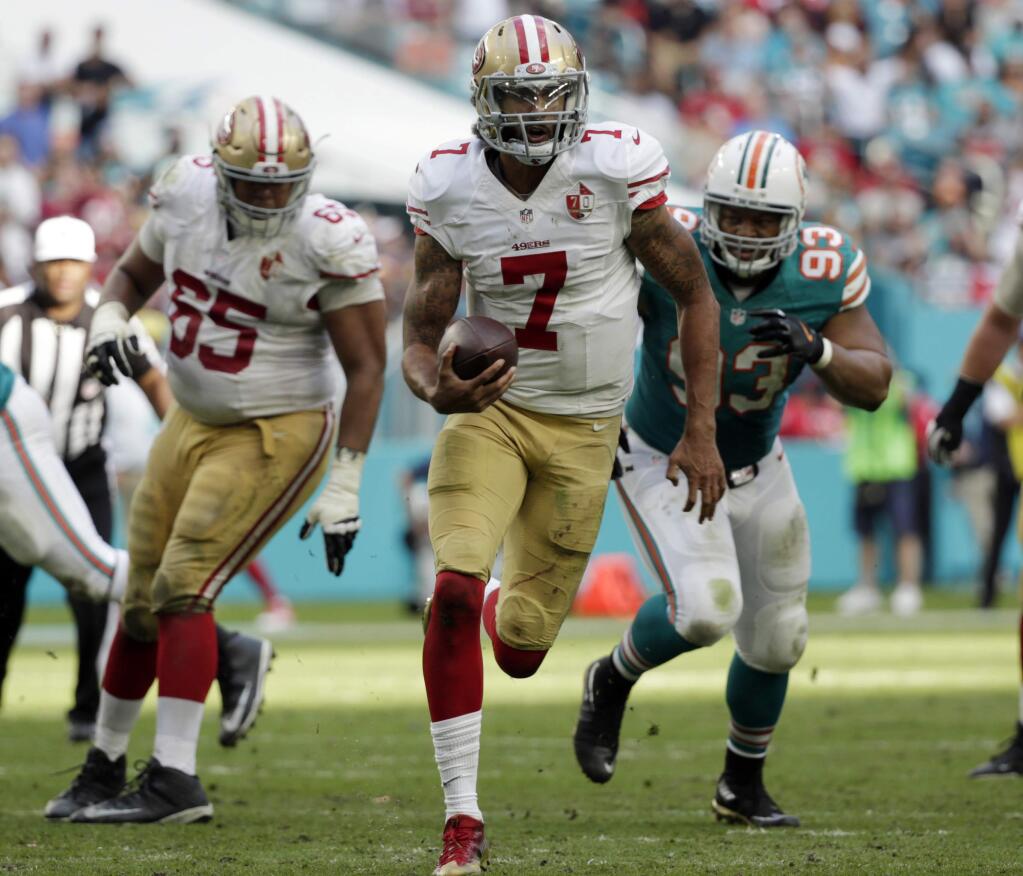 San Francisco 49ers quarterback Colin Kaepernick (7) run the ball, during the second half of an NFL football game against the Miami Dolphins, Sunday, Nov. 27, 2016, in Miami Gardens, Fla. (AP Photo/Wilfredo Lee)