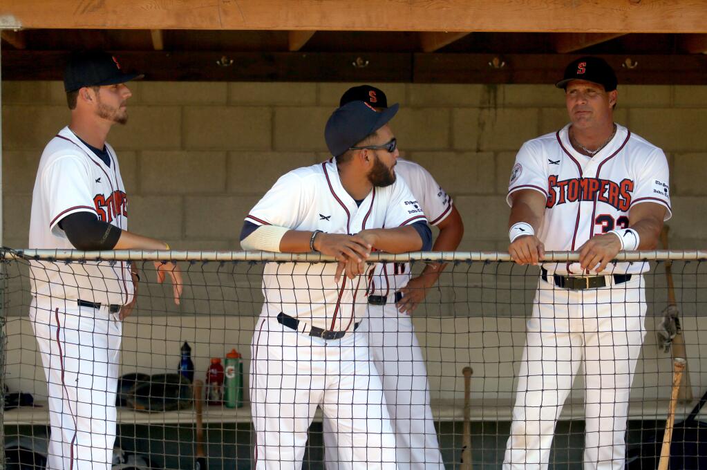 Jose Canseco (right), former big-league baseball star, was designated hitter for the Sonoma Stompers when they faced off against the San Rafael Pacifics at Arnold Field in Sonoma, Friday, June 12, 2015. (CRISTA JEREMIASON /THE PRESS DEMOCRAT)