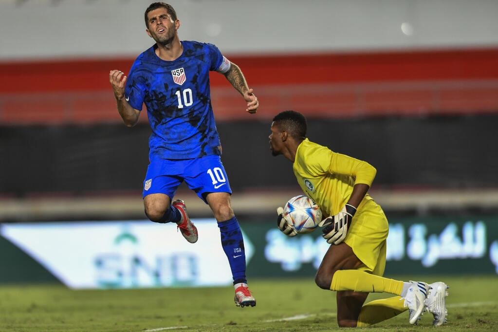 Saudi Arabia goalkeeper Mohammed Faraj Alyami, right, saves the ball next to the United States’ Christian Pulisic during Tuesday’s game in Murcia, Spain. (Jose Breton / ASSOCIATED PRESS)