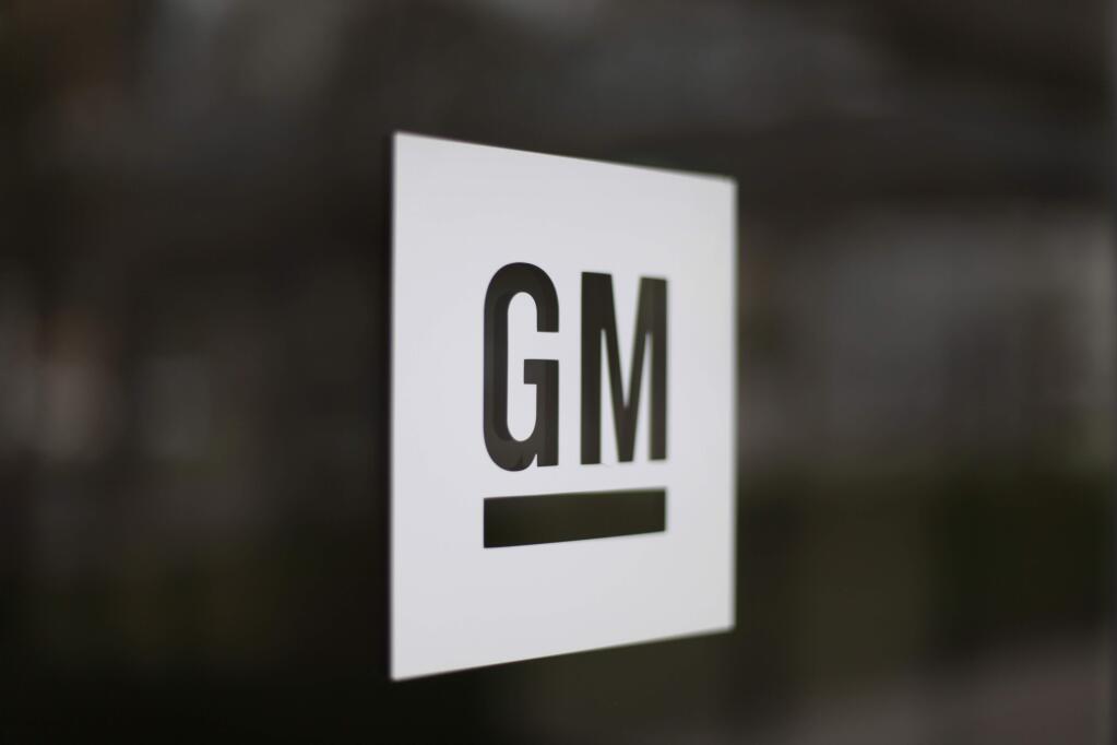 FILE - This Friday, May 16, 2014, file photo, shows the General Motors logo at the company's world headquarters in Detroit. From Wal-Mart to General Motors to Amazon, a growing number of the world's largest companies appear to be trying to get in step with President-elect Donald Trump's demand that employers hire and keep jobs at home. (AP Photo/Paul Sancya, File)