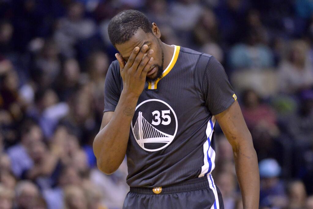 Golden State Warriors forward Kevin Durant (35) reacts on the court between plays in the second half of agame against the Memphis Grizzlies, Saturday, Dec. 10, 2016, in Memphis, Tenn. (AP Photo/Brandon Dill)