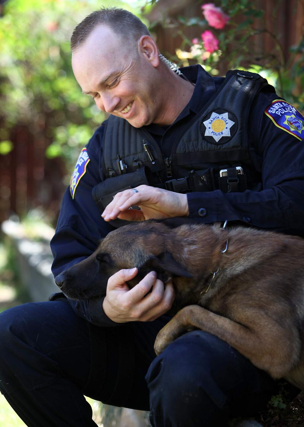 Santa Rosa Police K-9 Officer Mike Clark and his police dog Taz are seen in a 2010 file photo. (Christopher Chung / PD)