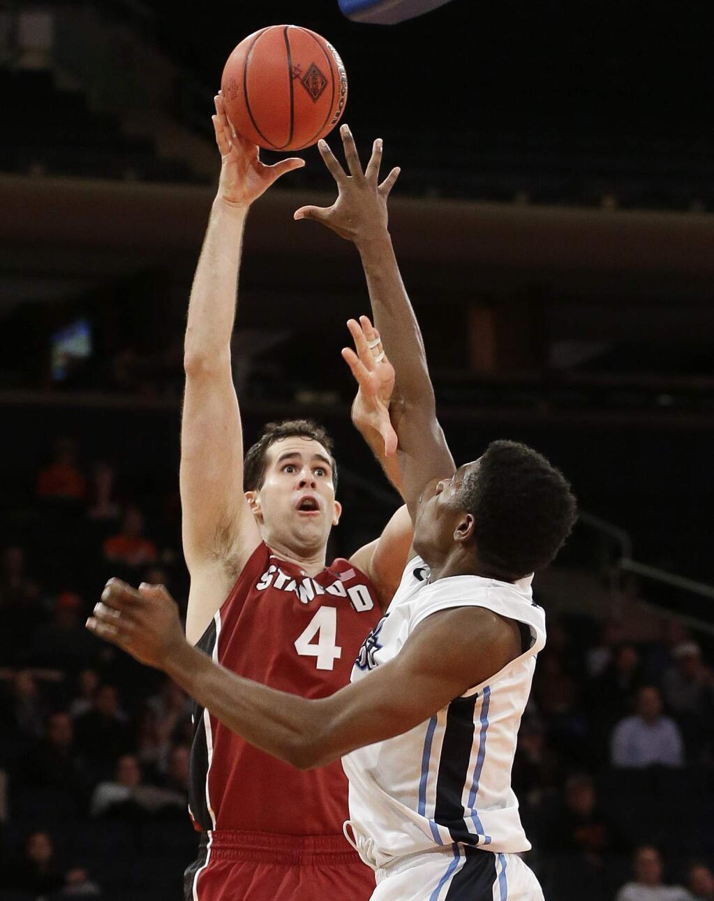 Stanford's Stefan Nastic (4) shoots over Old Dominion's Denzell Taylor (21) during the second half of a semifinal at the NIT college basketball tournament Tuesday, March 31, 2015, in New York. Stanford won 67-60. (AP Photo/Frank Franklin II)