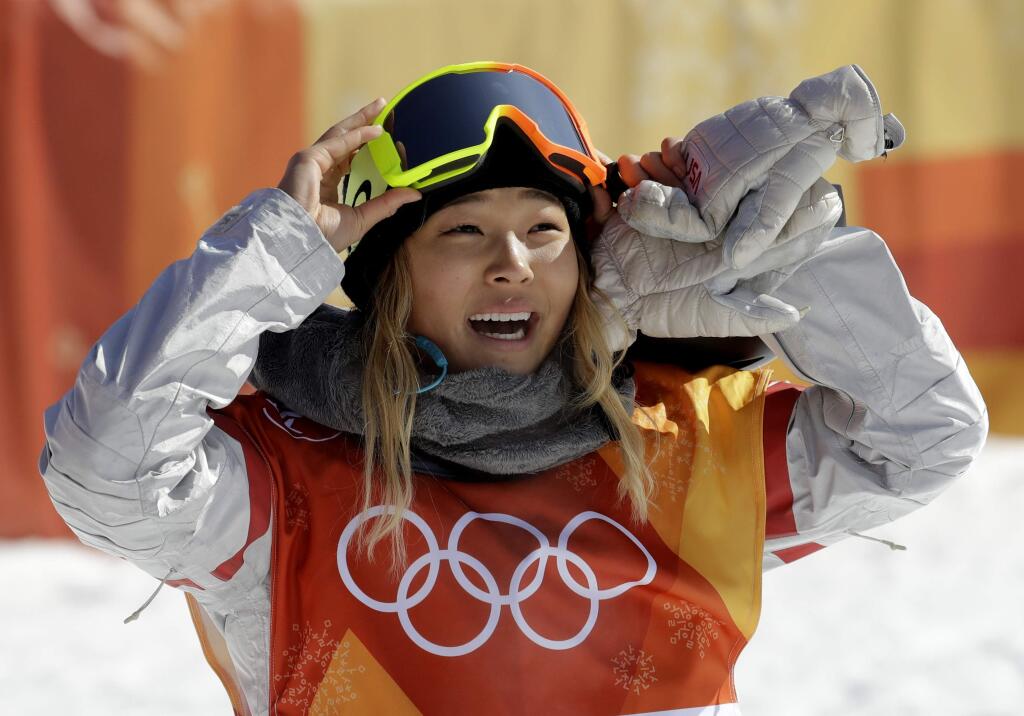 FILE - In this Tuesday, Feb. 13, 2018 file photo, Chloe Kim, of the United States, smiles during the women's halfpipe finals at Phoenix Snow Park at the 2018 Winter Olympics in Pyeongchang, South Korea. A San Francisco Bay Area radio station has fired one of its hosts, Patrick Connor, after he made sexual comments about 17-year-old Olympic snowboarder Kim on another station. Program director Jeremiah Crowe of KNBR-AM, where Connor hosted 'The Shower Hour,' confirmed the firing Wednesday, Feb. 14, 2018, for NBC Bay Area. (AP Photo/Lee Jin-man, File)