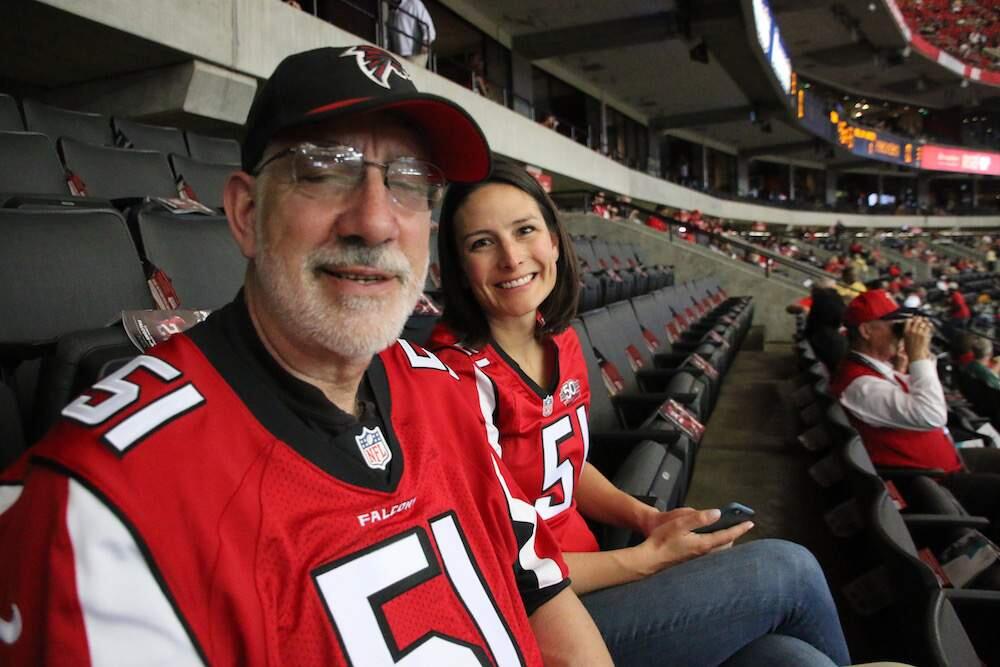 Steve Mack and his daughter Hailey sit waiting for a kickoff at the Georgia Dome where his son and her brother, Alex Mack, starts at center for the Atlanta Falcons. (Photo from Mack family)