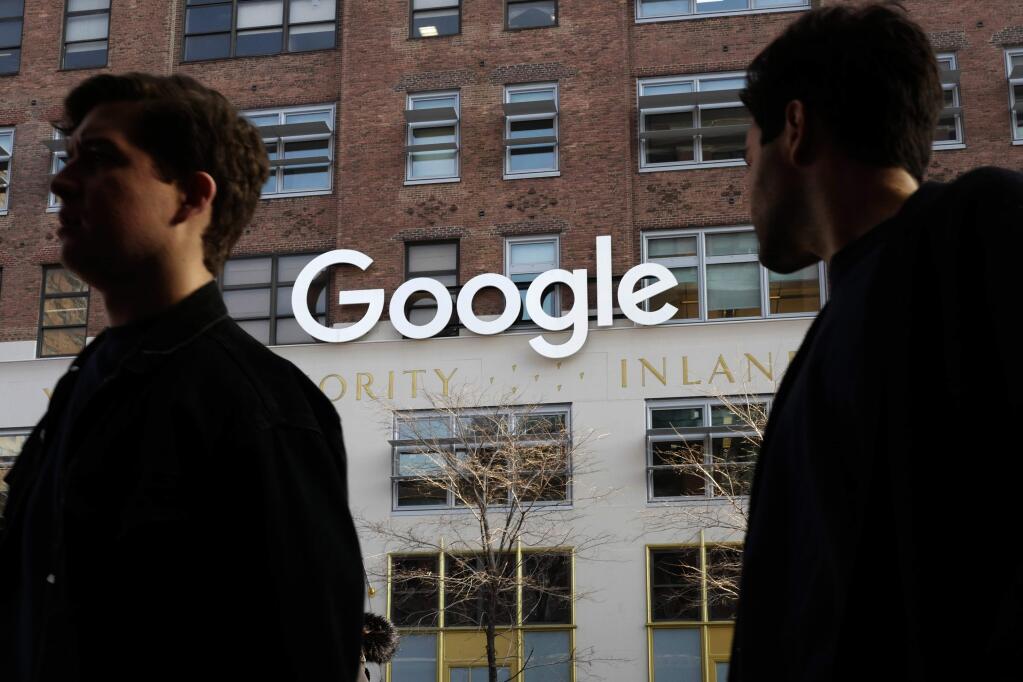 In this Dec. 4, 2017, photo, people walk by Google offices in New York. Google is blaming 'vandalism' at Wikipedia for search results that incorrectly said the ideology of the California Republican Party included 'Nazism.' The results appeared in a Google information box screen-captured by Vice Media on Thursday, May 31, 2018. Google quickly removed the section on ideology. (AP Photo/Mark Lennihan)