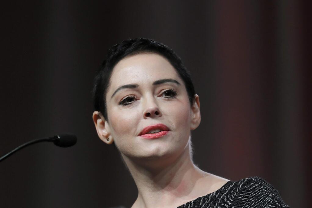 FILE- In this Oct. 27, 2017, file photo, actress Rose McGowan speaks at the inaugural Women's Convention in Detroit. (AP Photo/Paul Sancya, File)