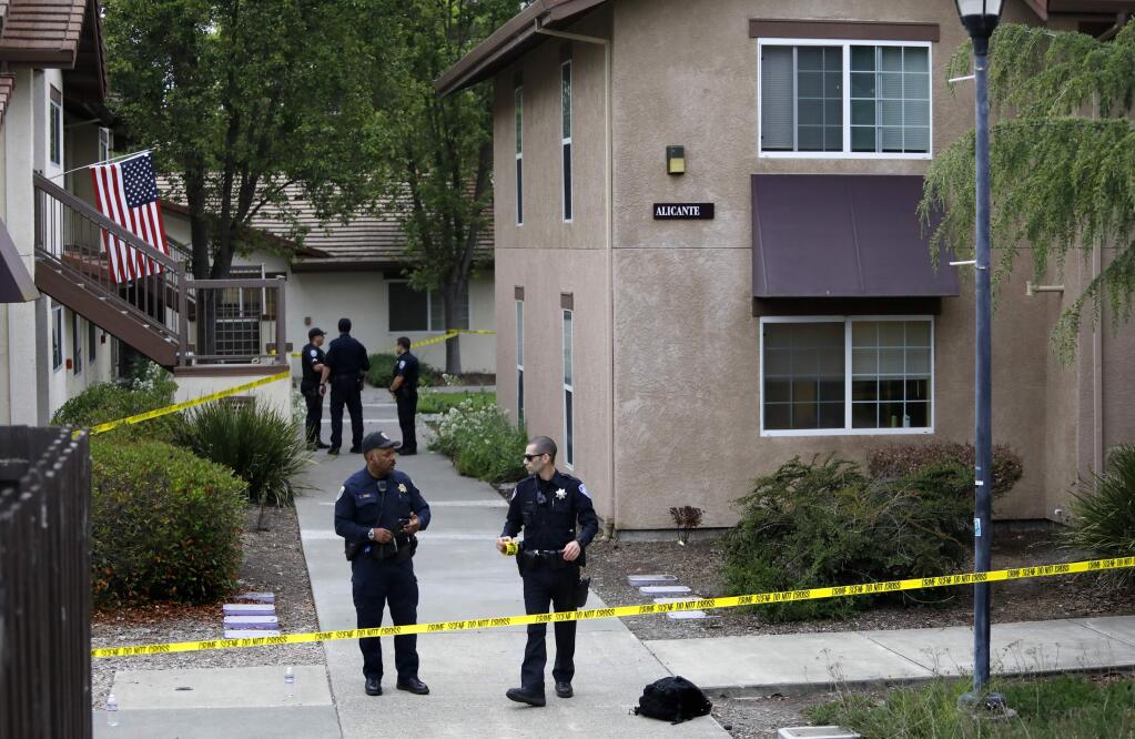 Cotati police officers investigate the scene of a fatal stabbing in the Alicante housing area of Sauvignon Village on the Sonoma State University campus in Rohnert Park on Sunday, May 13, 2018. (BETH SCHLANKER/ PD)