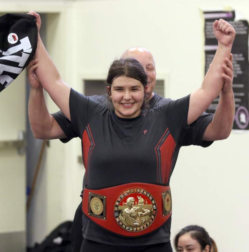 Michelle Larsen, the recipient of an enviable scholarship and sports package, is shown wearing the belt she won by placing first in the American Canyon tournament. (Scott Manchester/Argus-Courier Staff)