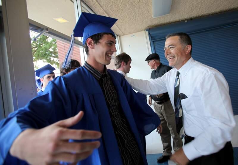Analy High School senior Michael Guglielmini, 19, with Raul Guerrero, vice principal, before graduation ceremonies that took place May 26, 2011.