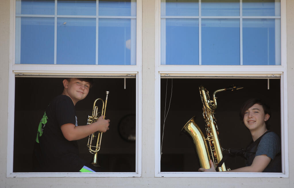 Casey, 11, and Cody Peters, 15, at their home in Windsor. The two music students have benefited from Rincon Valley's standout music program, but cuts to the comprehensive music program will affect Casey and others in the school district, Friday, July 17, 2020. (Kent Porter / The Press Democrat) 2020