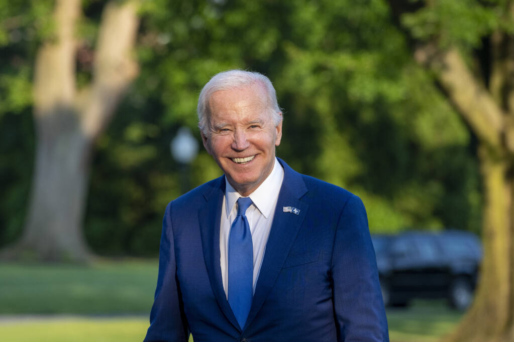 President Joe Biden smiles as he walks from Marine One upon arrival on the South Lawn of the White House, Thursday, June 1, 2023, in Washington. Biden is returning from Colorado. (AP Photo/Alex Brandon)