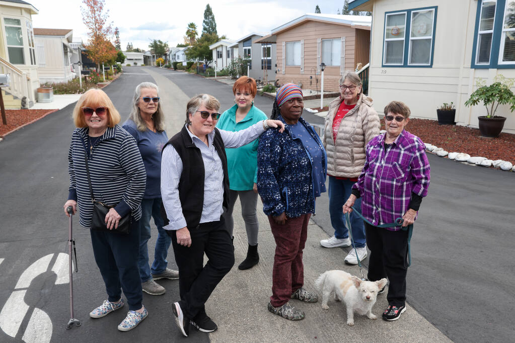 Residents of the Windsor Mobile Country Club Fran Reilly, left, Kendra Heath, Patti Restaino, Dee Raef, Sharon White, Vicki White, and Jeaneen Titsworth want a cap on rent increases. Photo taken in Windsor on Wednesday, November 2, 2022.  (Christopher Chung/The Press Democrat)