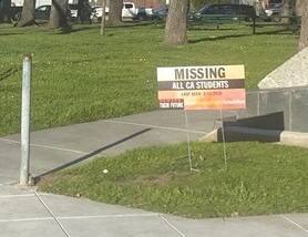 "Missing: All CA Students“ signs, like the one seen here planted on Petaluma city property, caused a stir in town this week. Petaluma prohibits the installation of signs of any kind on city property. (JANICE CADER THOMPSON/FOR THE ARGUS-COURIER)