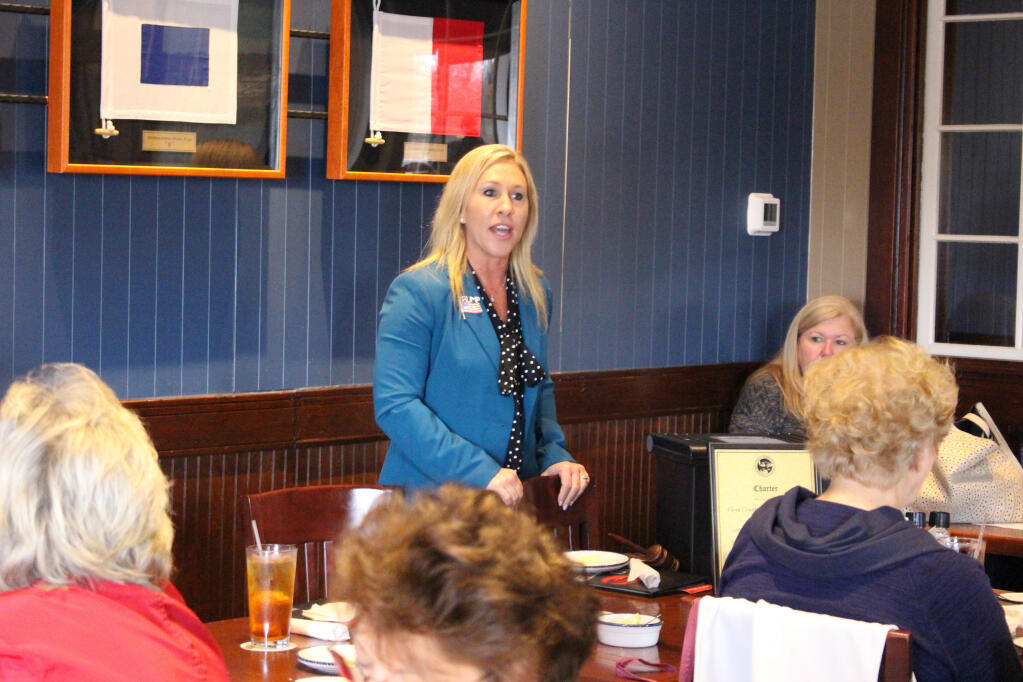 Republican Marjorie Taylor Greene speaks to a GOP women's group on March 3, 2020, in Rome, Ga. Greene is one of nine Republicans seeking her party's nomination in Georgia's 14th Congressional District on Tuesday, June 9, 2020. (John Bailey/Rome News-Tribune via AP)