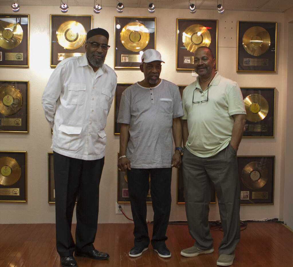 FILE - Musicians Kenneth Gamble, left, Leon Huff, center, and Thom Bell stand together at Gamble and Huff Music, on Broad Street, in Philadelphia, on Thursday, May 30, 2013. Bell, the Grammy-winning producer, writer and arranger who helped perfect the “Sound of Philadelphia” of the 1970s with the inventive, orchestral settings of such hits as the Spinners’ “I’ll Be Around” and the Stylistics’ “Betcha by Golly, Wow,” has died at age 79. Bell's wife, Vanessa Bell, said that he died Thursday, Dec. 22, 2022 at his home in Bellingham, Washington, after a lengthy illness. (Stephanie Aaronson/The Philadelphia Inquirer via AP)