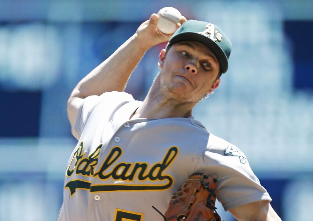 Oakland Athletics pitcher Sonny Gray throws against the Minnesota Twins in the first inning of a baseball game Wednesday, July 6, 2016, in Minneapolis. (AP Photo/Jim Mone)