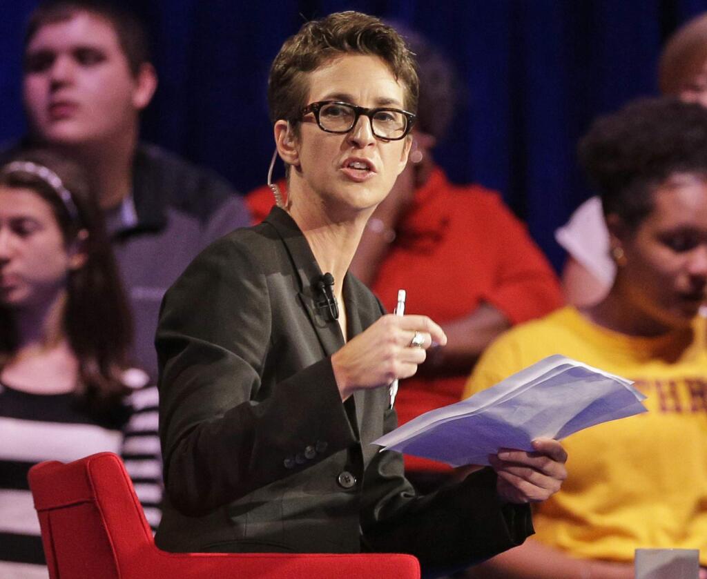 FILE - In this Friday, Nov. 6, 2015, file photo, MSNBC's Rachel Maddow speaks during a Democratic presidential candidate forum at Winthrop University in Rock Hill, S.C. Maddow has turned politics into prime-time entertainment for people worried about the state of the new presidency. MSNBC achieved other milestones in July, including its closest finish to Fox since 2000 and largest margin of victory over CNN ever. (AP Photo/Chuck Burton, File)