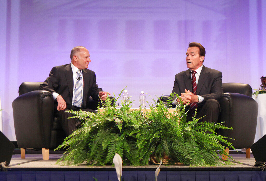 Allen Zaremberg, the president of the California Chamber of Commerece, speaks with Gov. Arnold Schwarzenegger at the organization’s annual host breakfast in 2010. (RICH PEDRONCELLI / Associated Press)