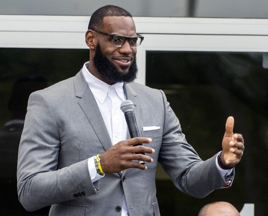 In this Monday, July 30, 2018, file photo, LeBron James speaks at the opening ceremony for the I Promise School in Akron, Ohio. James has yet to play a minute for the Los Angeles Lakers, yet the NBA superstar is churning out content for the small screen. James is behind the three-part documentary series 'Shut Up and Dribble' announced Monday, Aug. 6, 2018, by Showtime. (AP Photo/Phil Long, File)